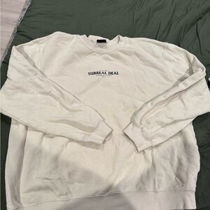 Cotton On Cream Crewneck Sweatshirt with 'Surreal Deal' Print